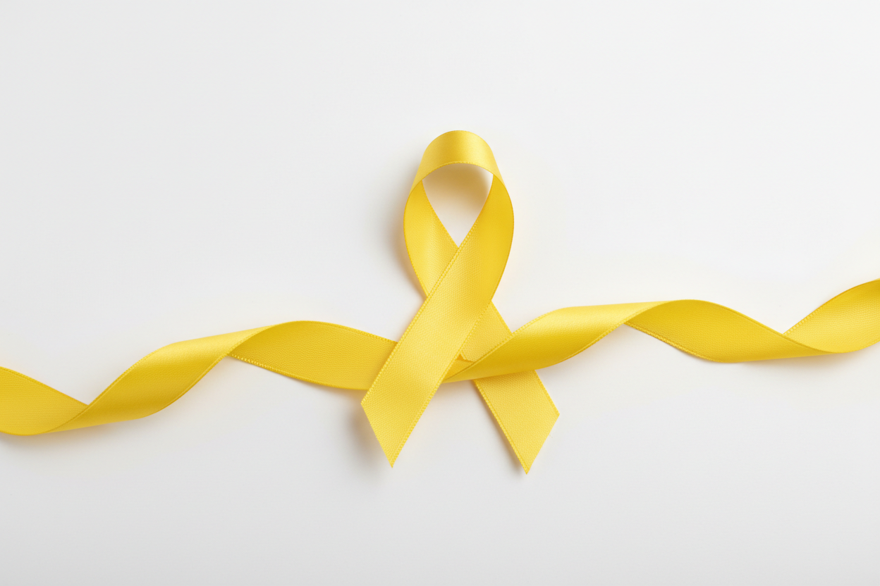 Yellow awareness ribbon on white background representing endometriosis support