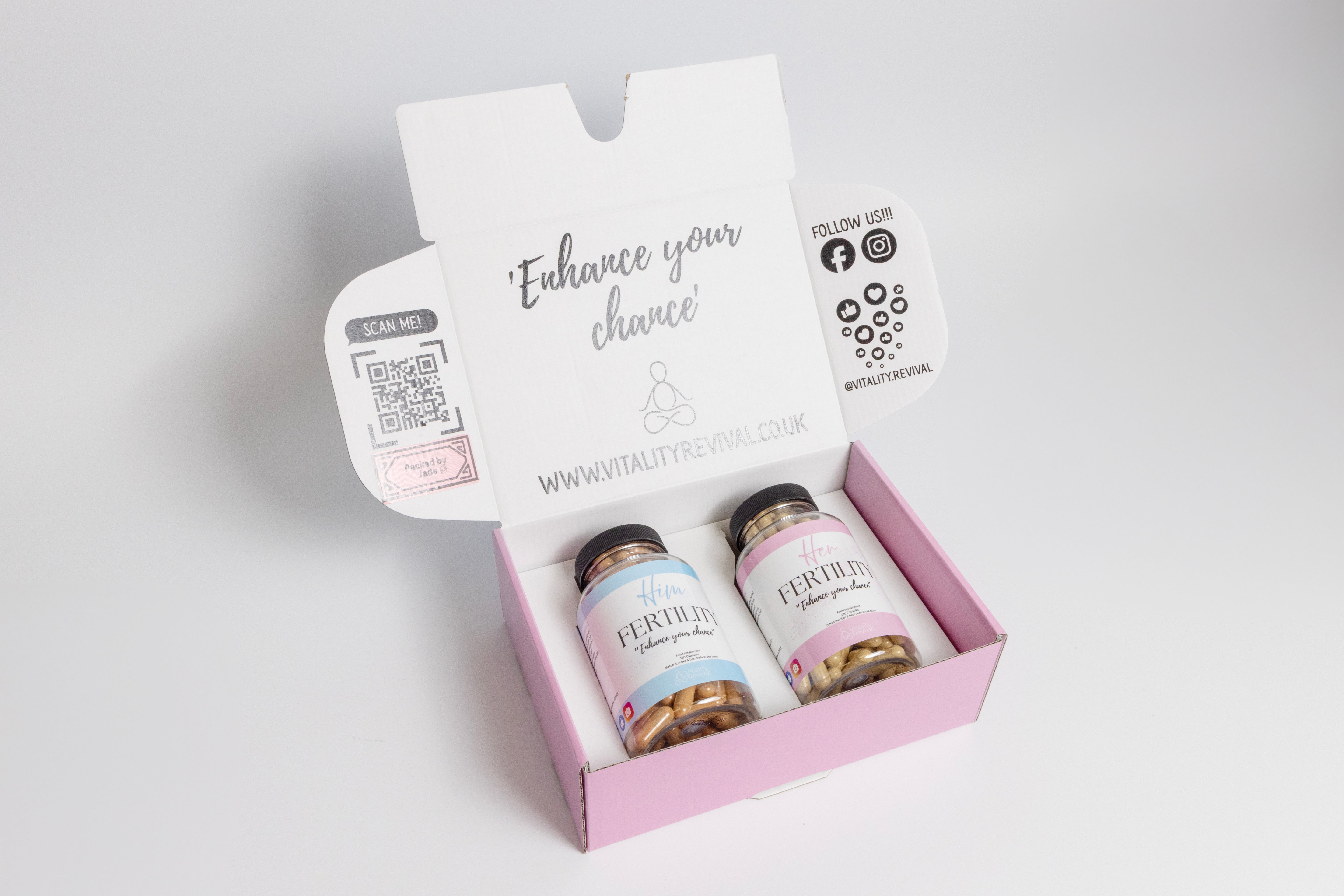 Open box with Him and Her fertility supplements bottles inside on white background