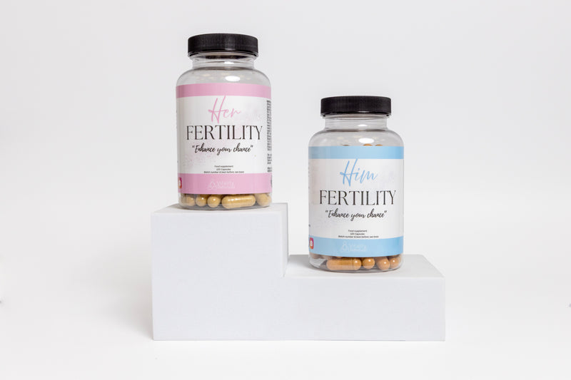 Her and Him fertility supplements for men and women on display, clear bottles with capsules