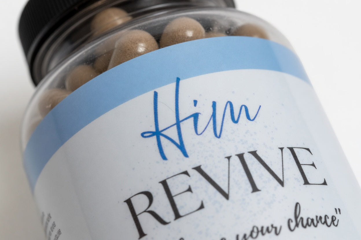 Jar of brown capsules with a label reading 'Him Revive' on a white background